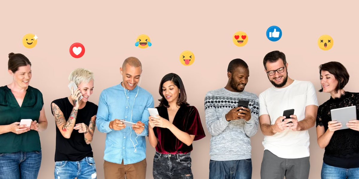 B2b social media trends - line of people looking at cell phones with various emojis above them