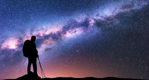 hiker staring into the vastness of space