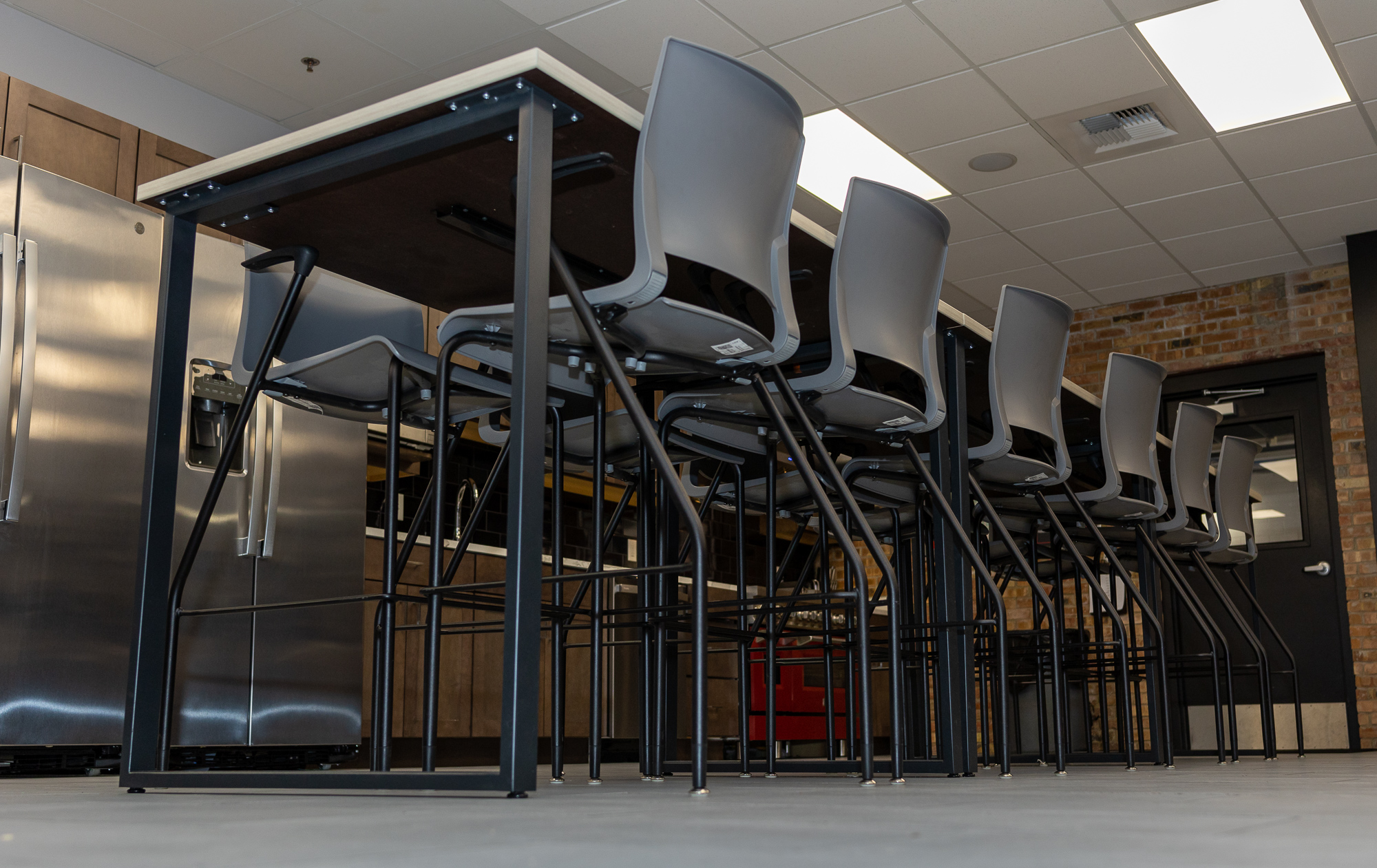 photo looking upwards at high top table and chairs