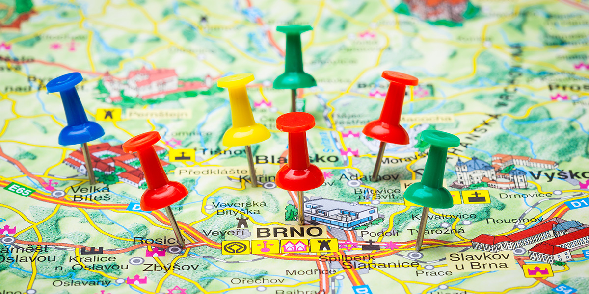 20250429_SPW_LocalSEOPins_1200x600 Travel destination points on a map indicated with colorful thumbtacks