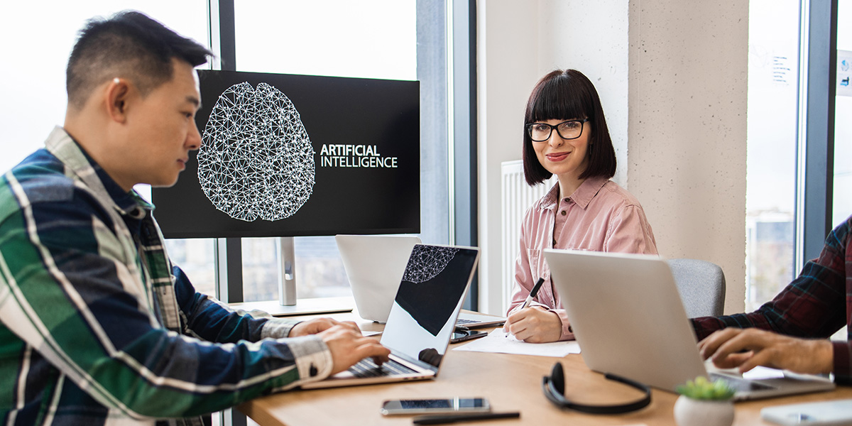 marketing experts working on artificial intelligence development in modern office