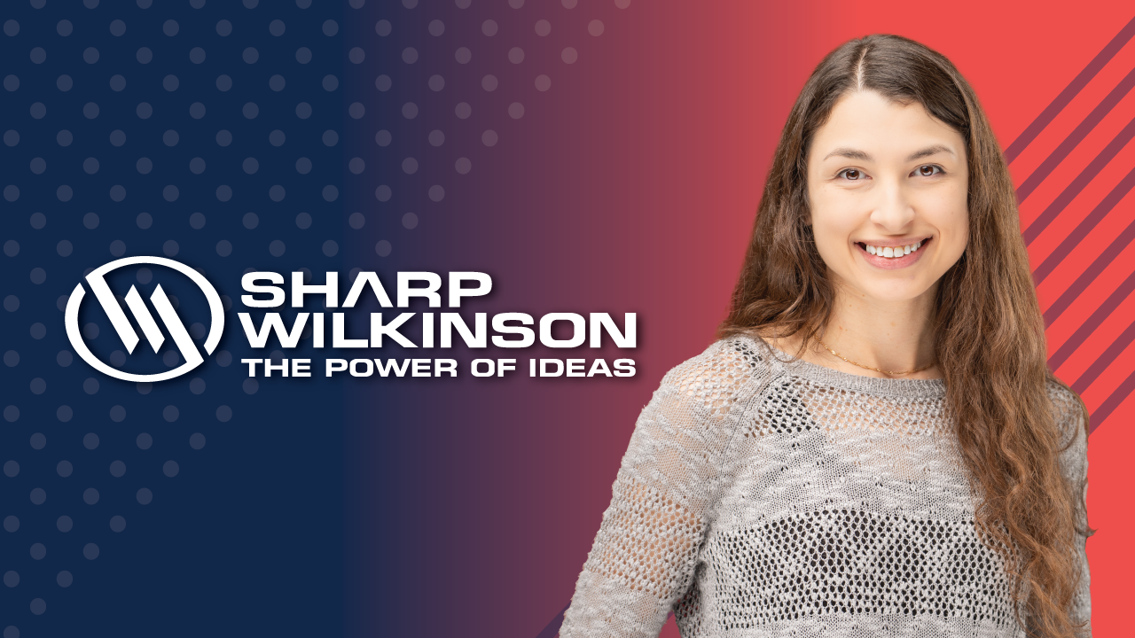 Brittany on red and blue background with Sharp Wilkinson logo
