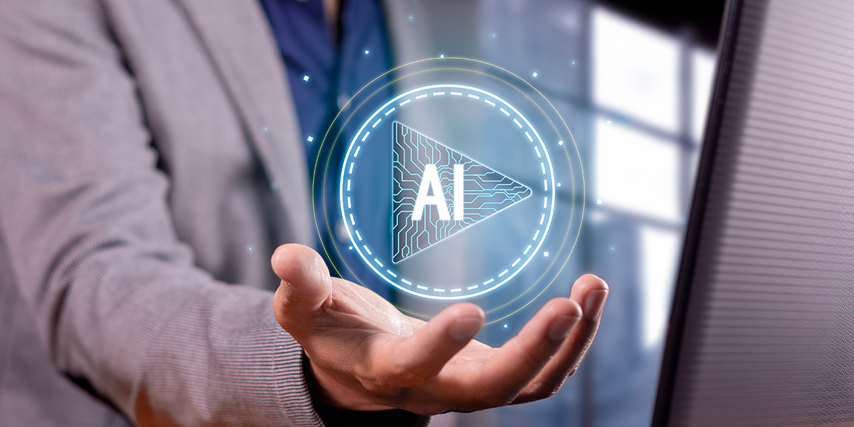 Person holding their hand out with a digital AI bubble hovering over it