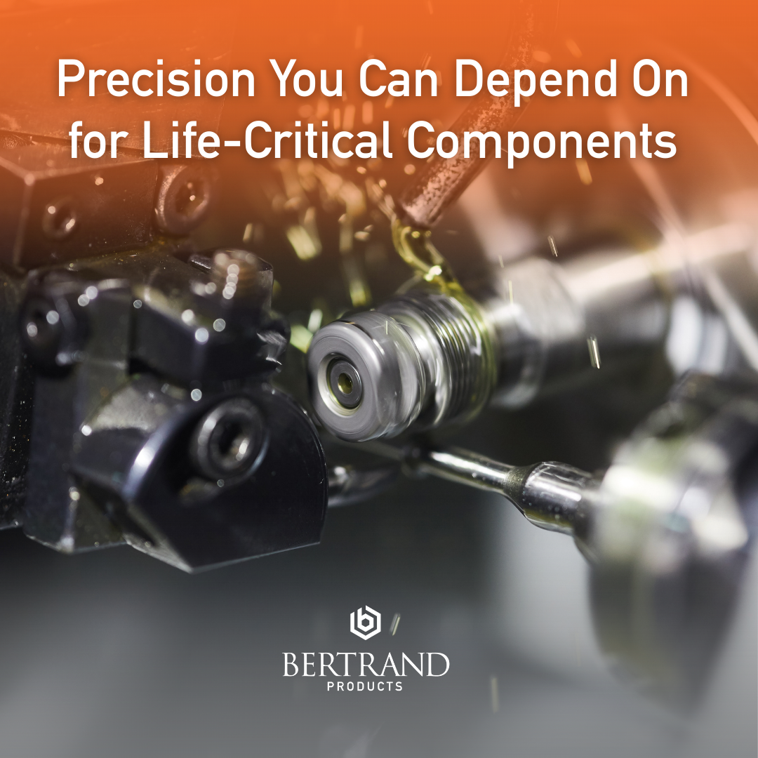 Close-up of precision machining tools with an orange overlay, displaying the headline “Precision You Can Depend On for Life-Critical Components” and the Bertrand Products logo below.