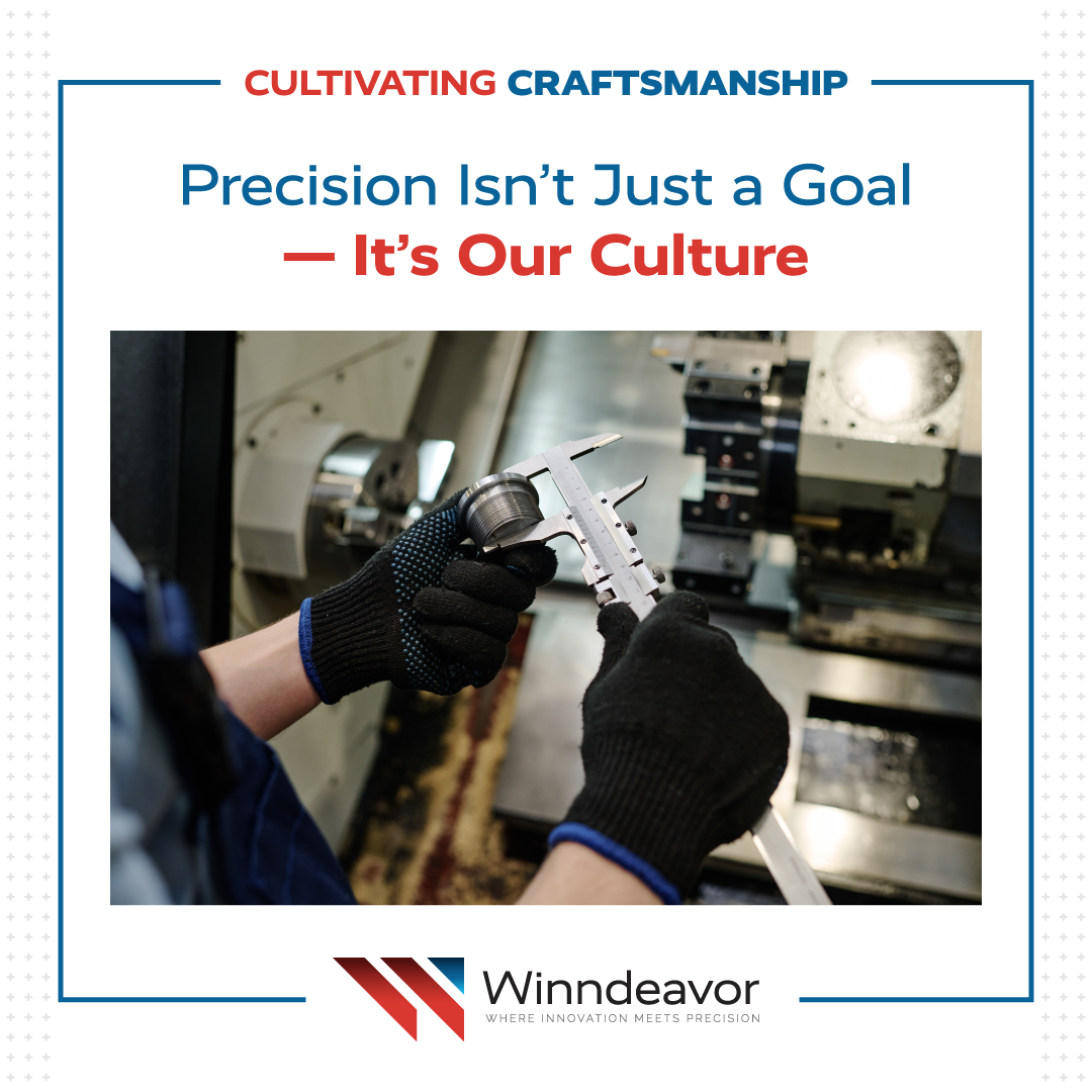 Close-up of gloved hands using calipers to measure a metal cylinder on a CNC machine in a workshop.