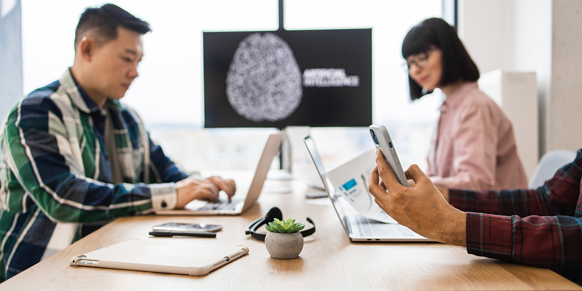 Teamwork session on artificial intelligence development in modern office