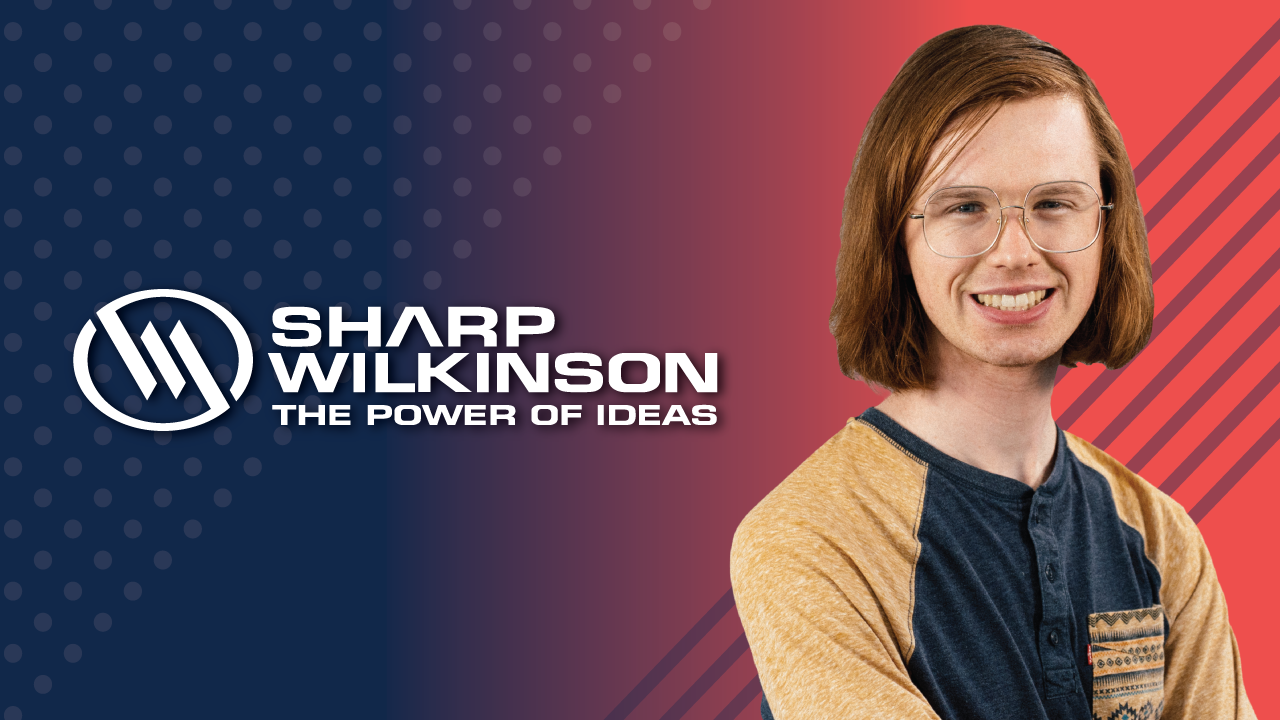 Brand banner with Sharp Wilkinson logo and 'The Power of Ideas' slogan on the left, and a smiling person on the right against a blue-to-red gradient background with diagonal stripes on the red side.