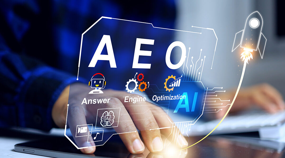 Close-up of a hand touching a tablet with holographic AI graphics labeled AEO, gears, and a launching rocket to symbolize AI-powered optimization.